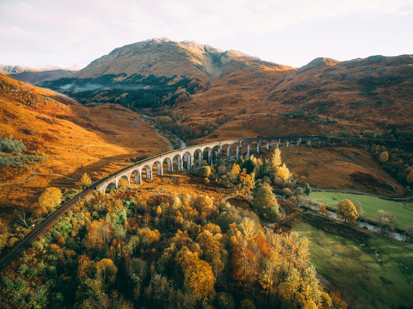 The Jacobite steam train crossing Glenfinnan Viaduct in the Scottish Highlands